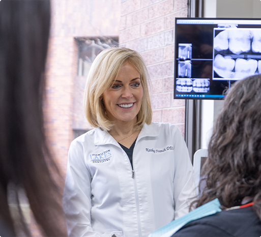 Dentist talking to dental patient