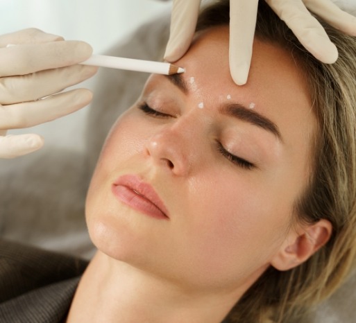 Dentist preparing dental patient for Botox treatment