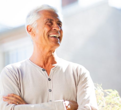 Smiling man enjoying the benefits of dental implants