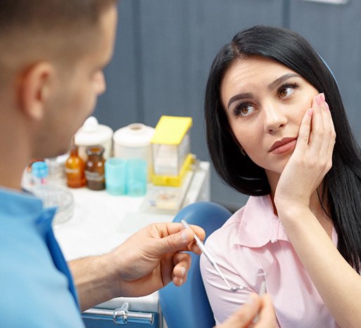 Dentist talking to patient in Itasca