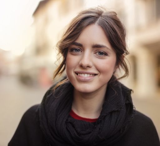 Woman with healthy smile after fluoride treatment