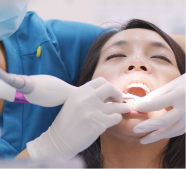 Dental patient receiving scaling and root planing treatment