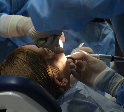 Dentist performing surgery