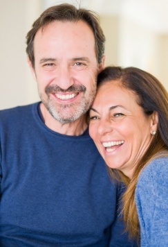 Laughing older man and woman wearing blue shirts