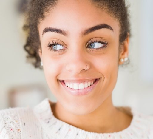 Closeup of dental patient smiling after Invisalign treatment