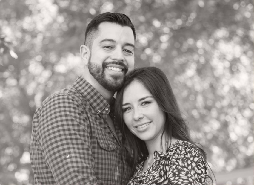 Man and woman with healthy smiles after laser periodontal treatment