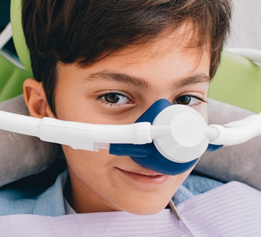 Dental patient with nitrous oxide sedation dentistry mask