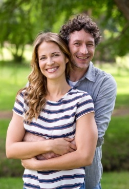 Man and woman smiling after visiting the sedation dentist