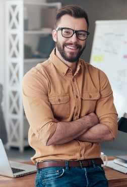 Man smiling after pain relieving T M J treatment