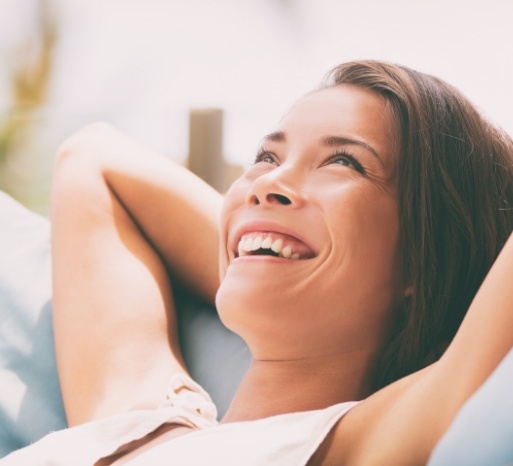 Woman laughing after smile design treatment