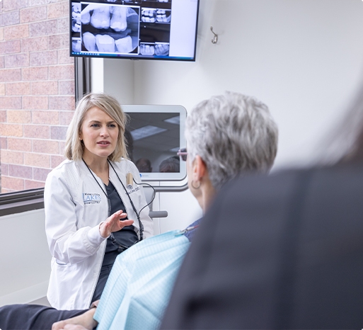 Dentist and dental patient discussing digital x rays