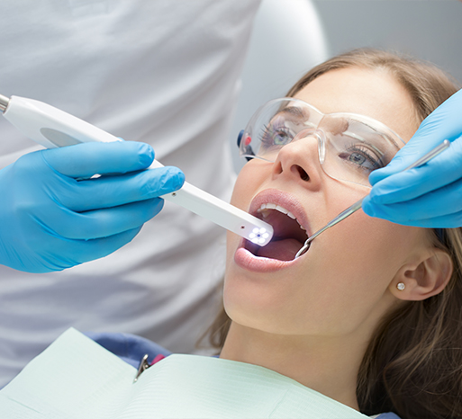 Dentist using intraoral camera to capture smile photos