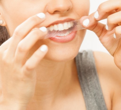 Dental patient using at home teeth bleaching system